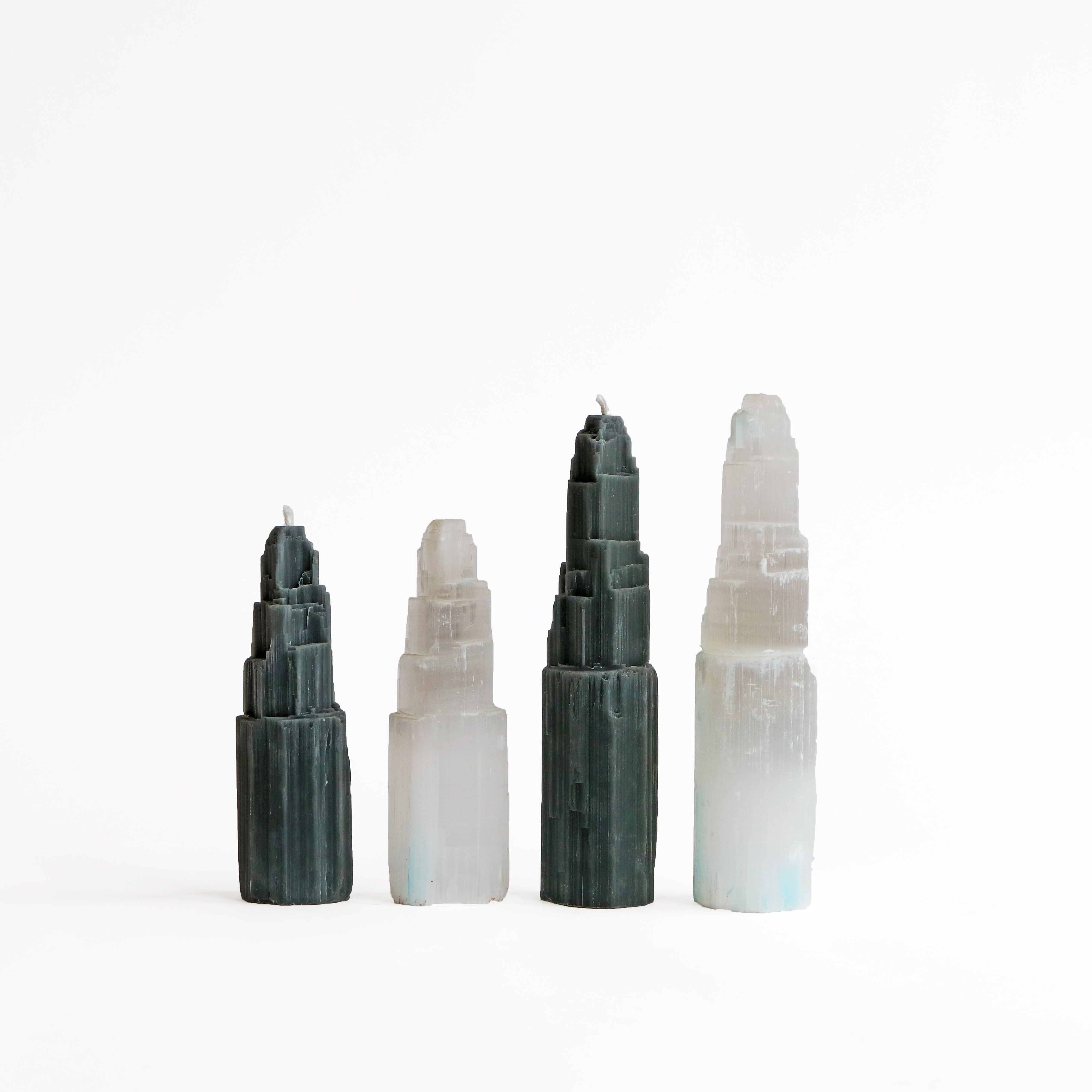 black candles with crystal towers