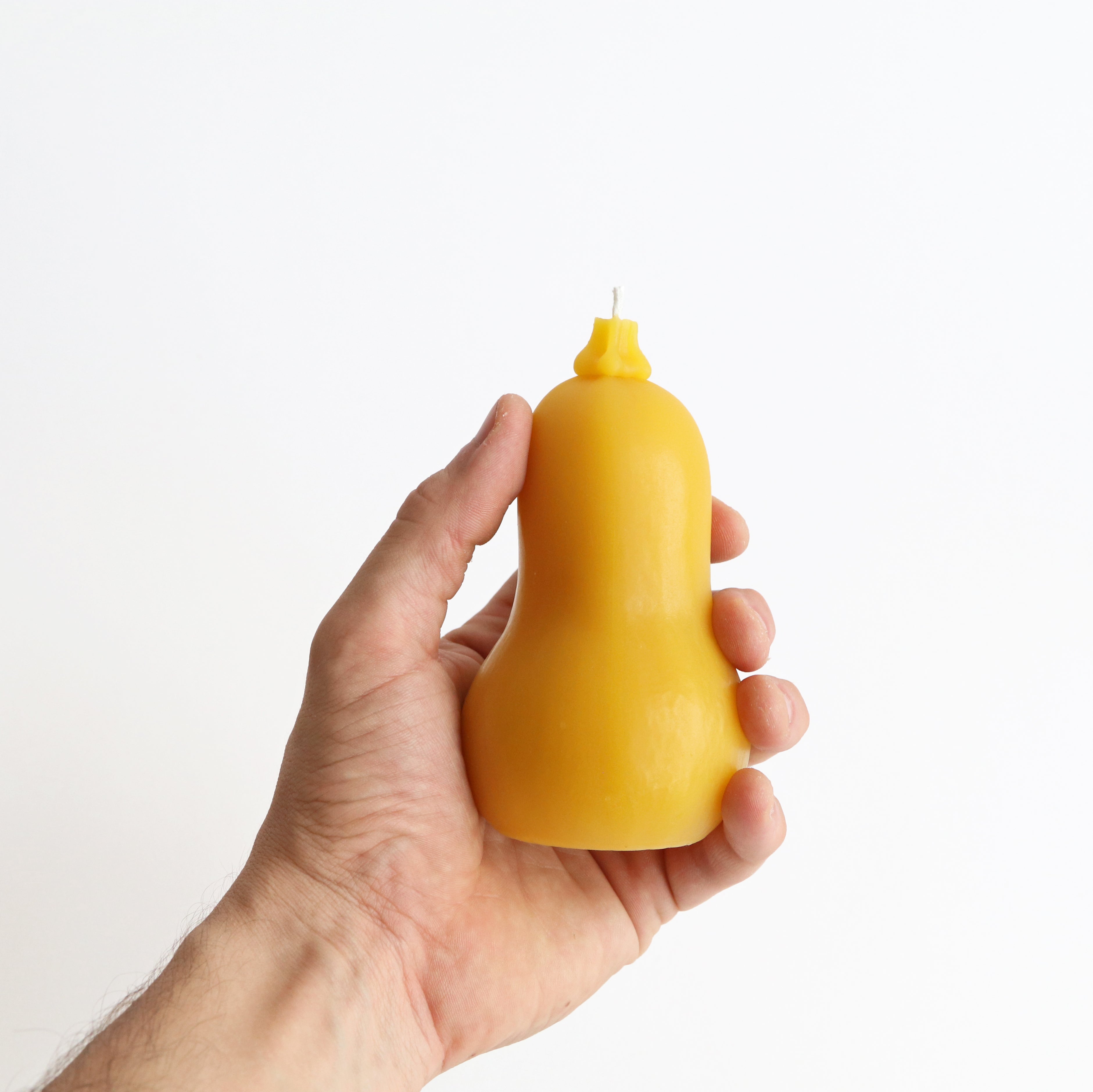 Butternut squash candle in hand