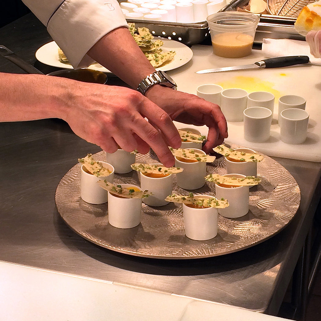hands plating silver serving platter