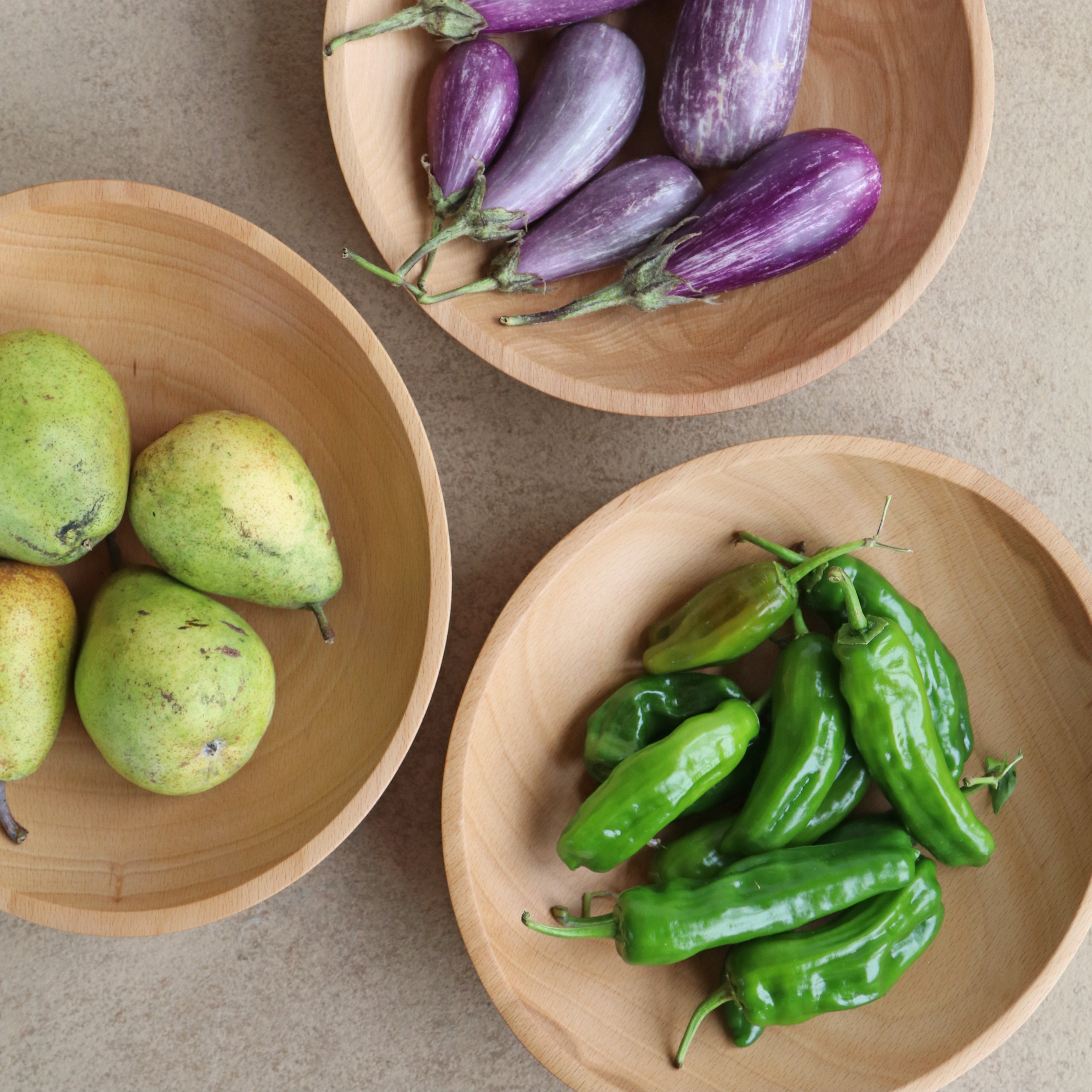 three bowls with colorful vegetables