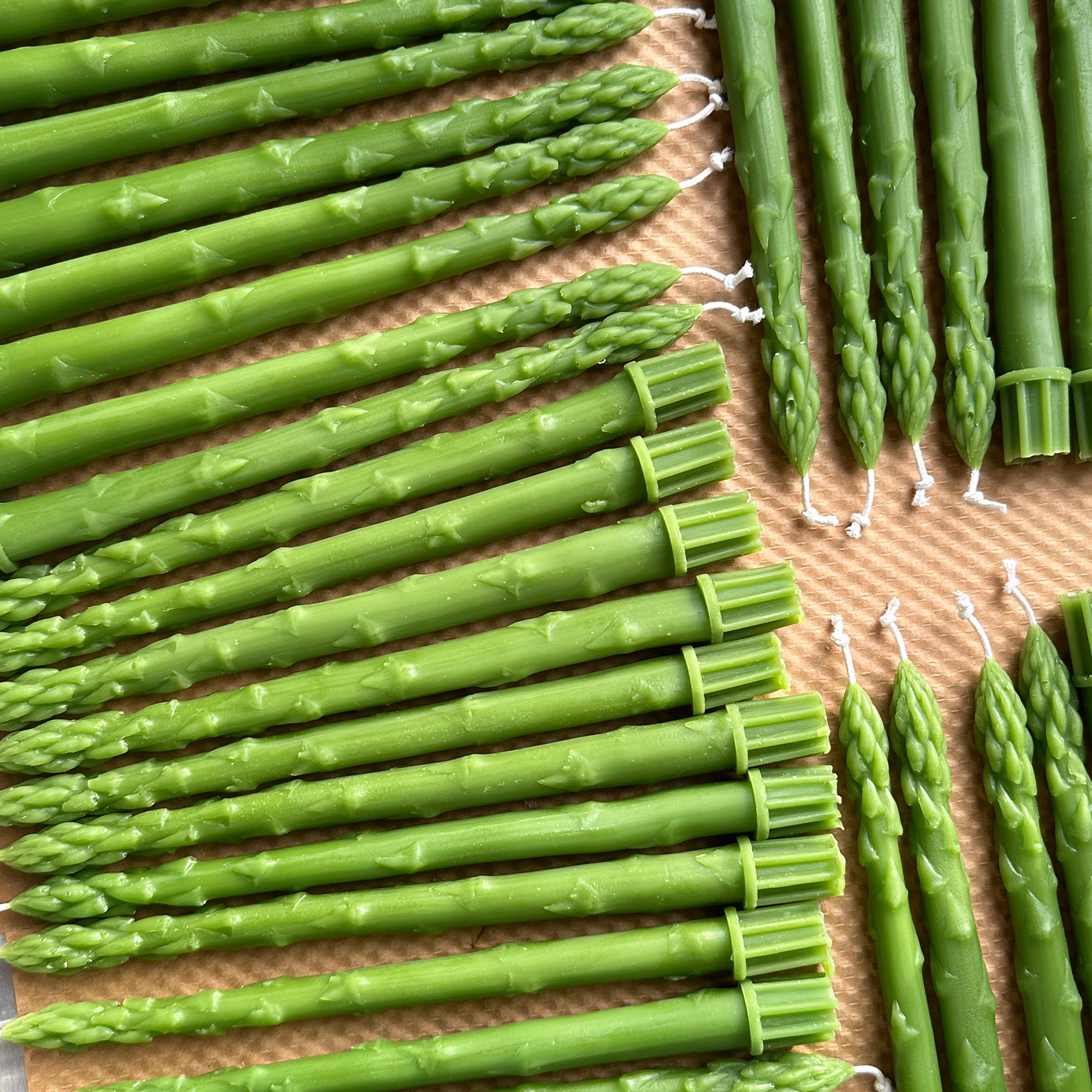 tray of green asparagus beeswax candles