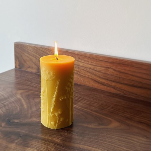 lit flower pillar candle