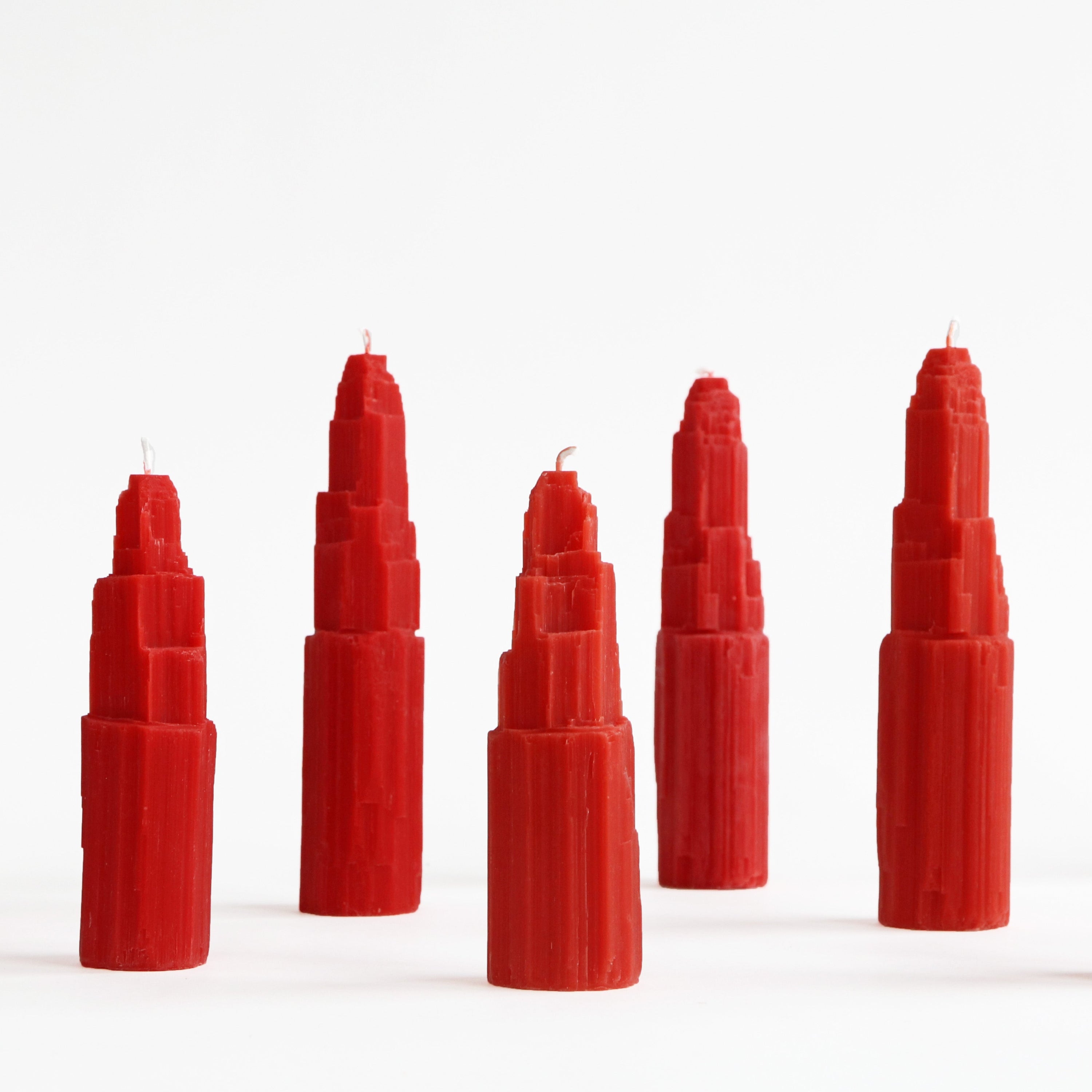 five red crystal tower candles