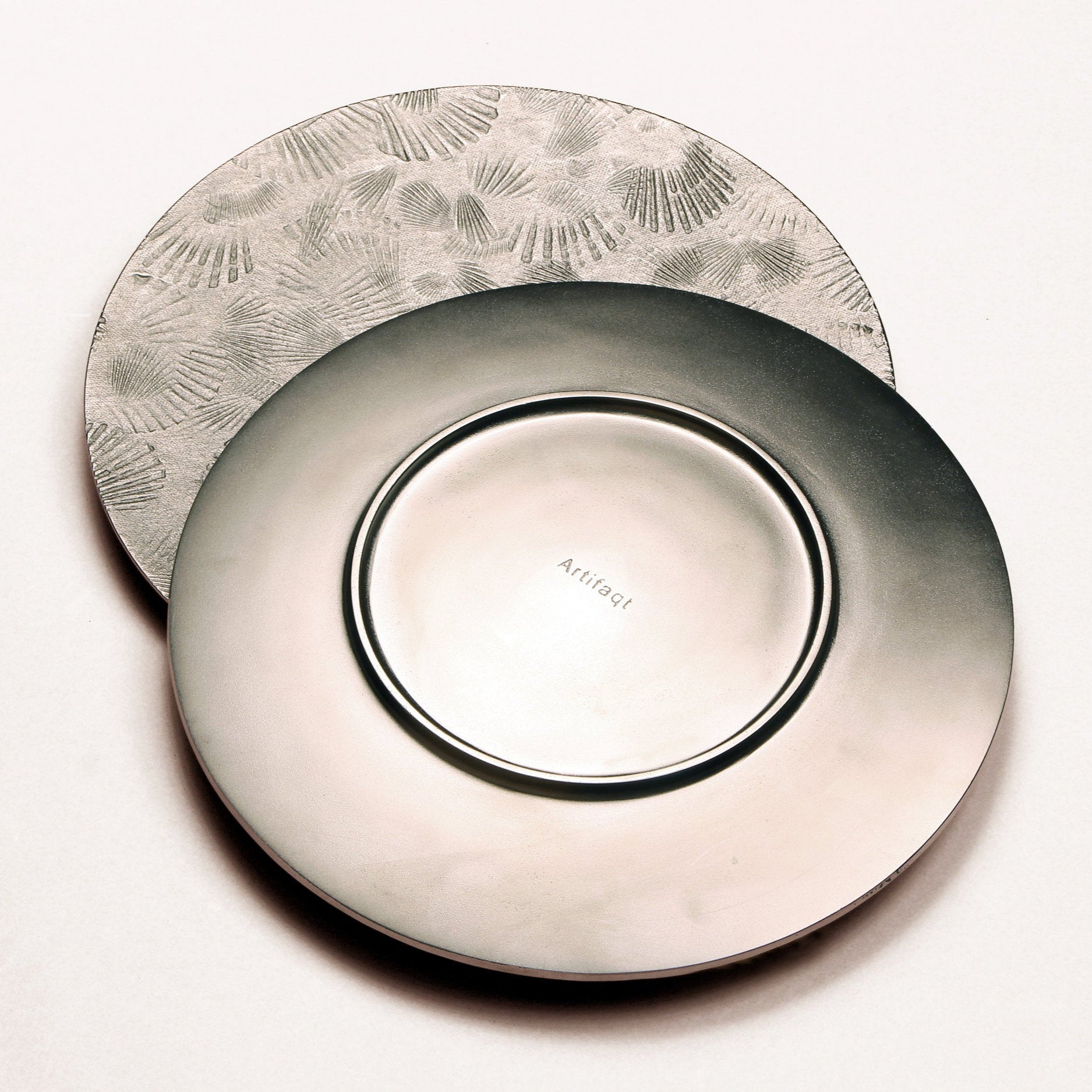 front and back of silver serving tray with scallop shell impressions