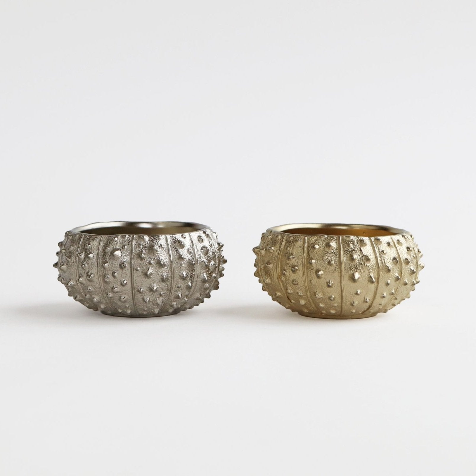 silver and gold sea urchin bowls