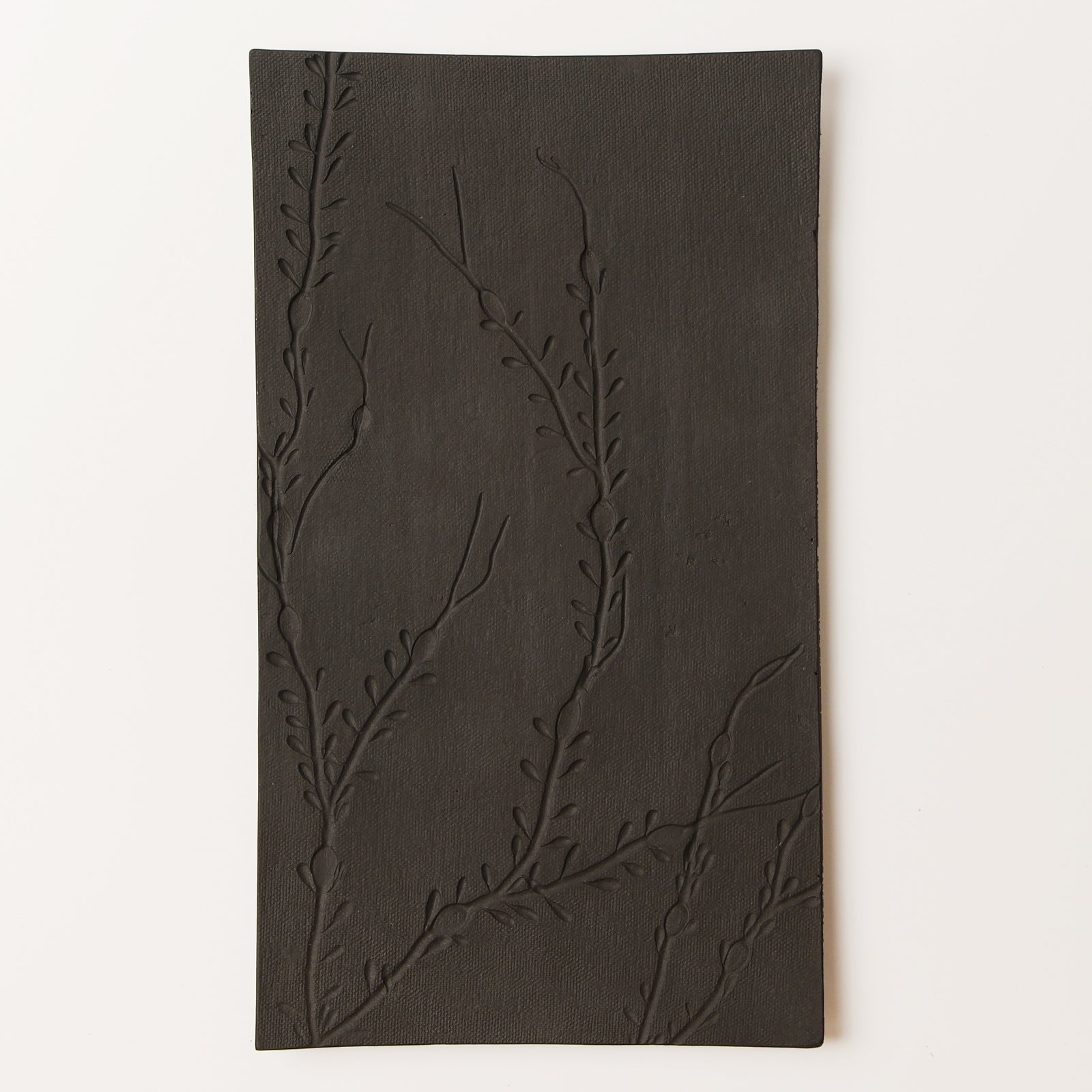 black metal serving platter with seaweed texture