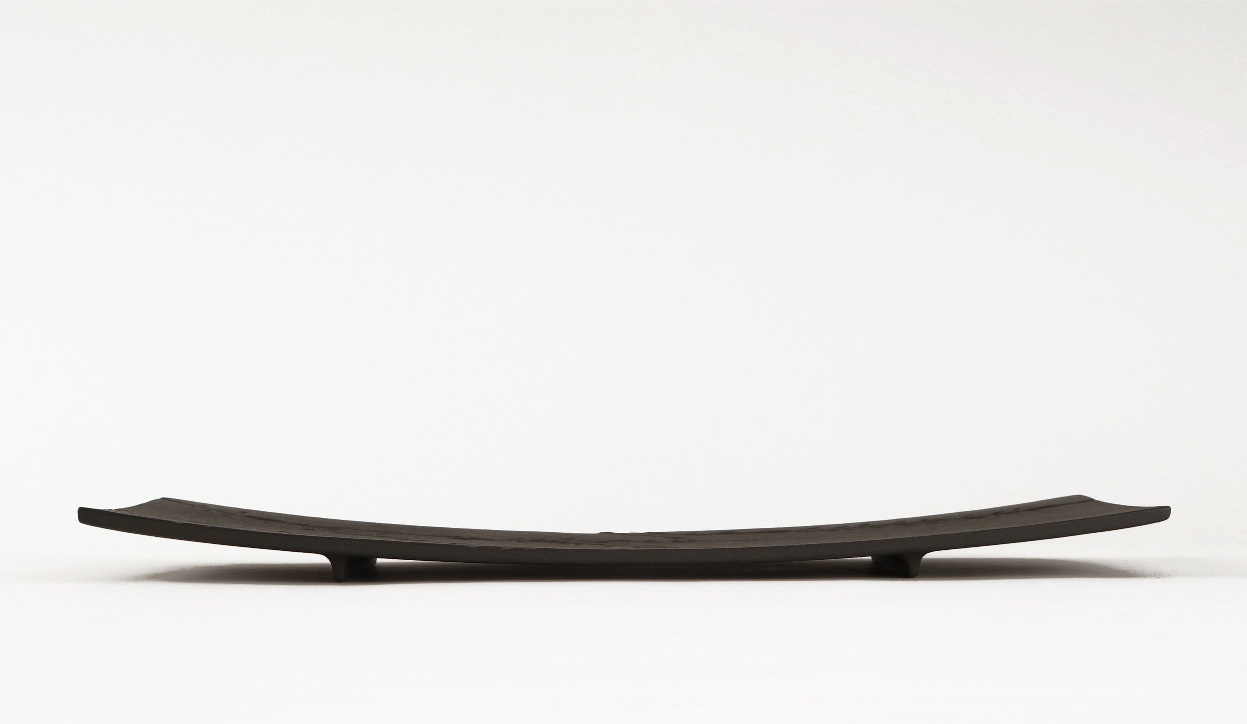 side view of black metal tray