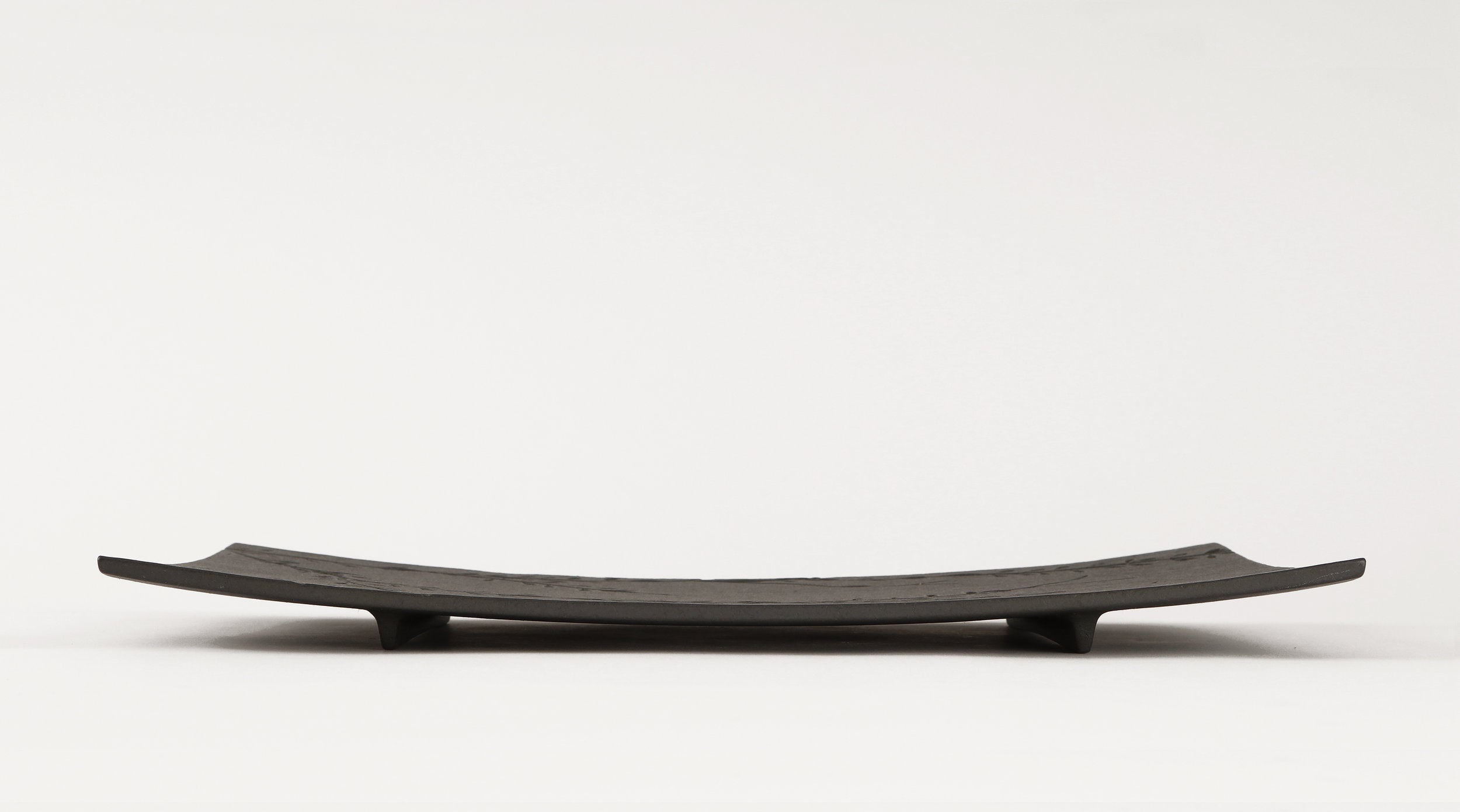 side view of metal serving platters