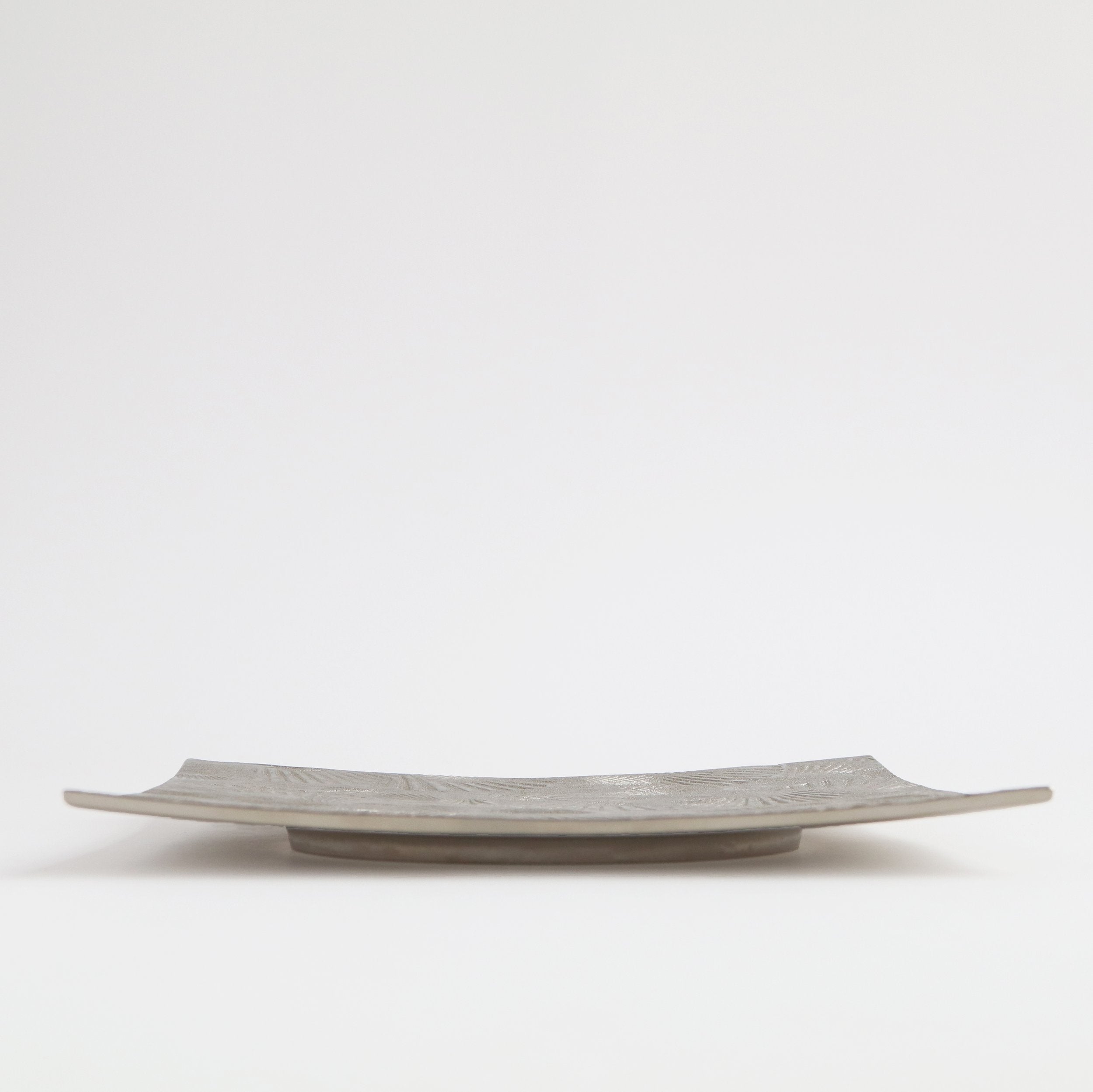 silver serving platter from side