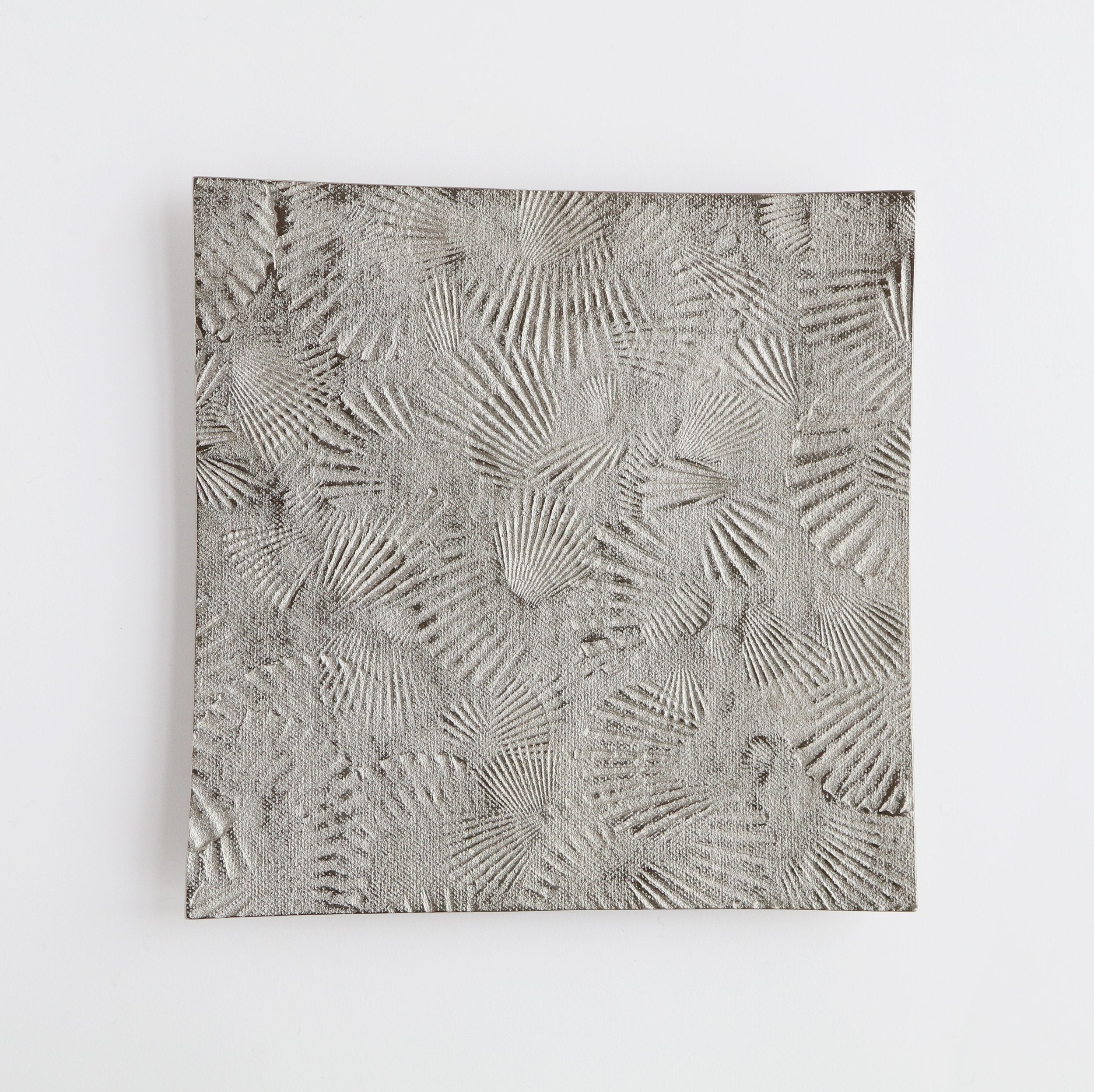 silver metal platter with scallop texture