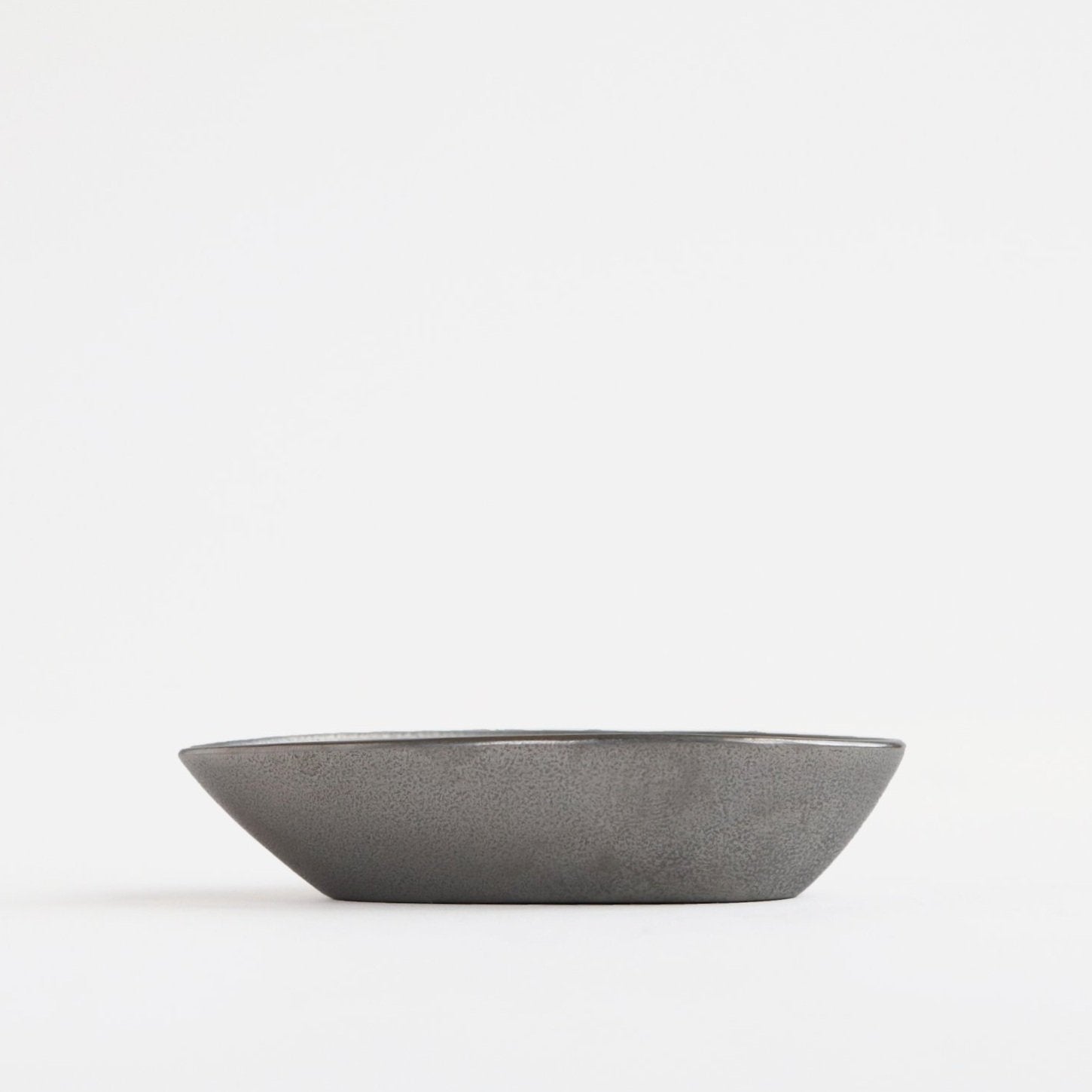 side view of small metal cup