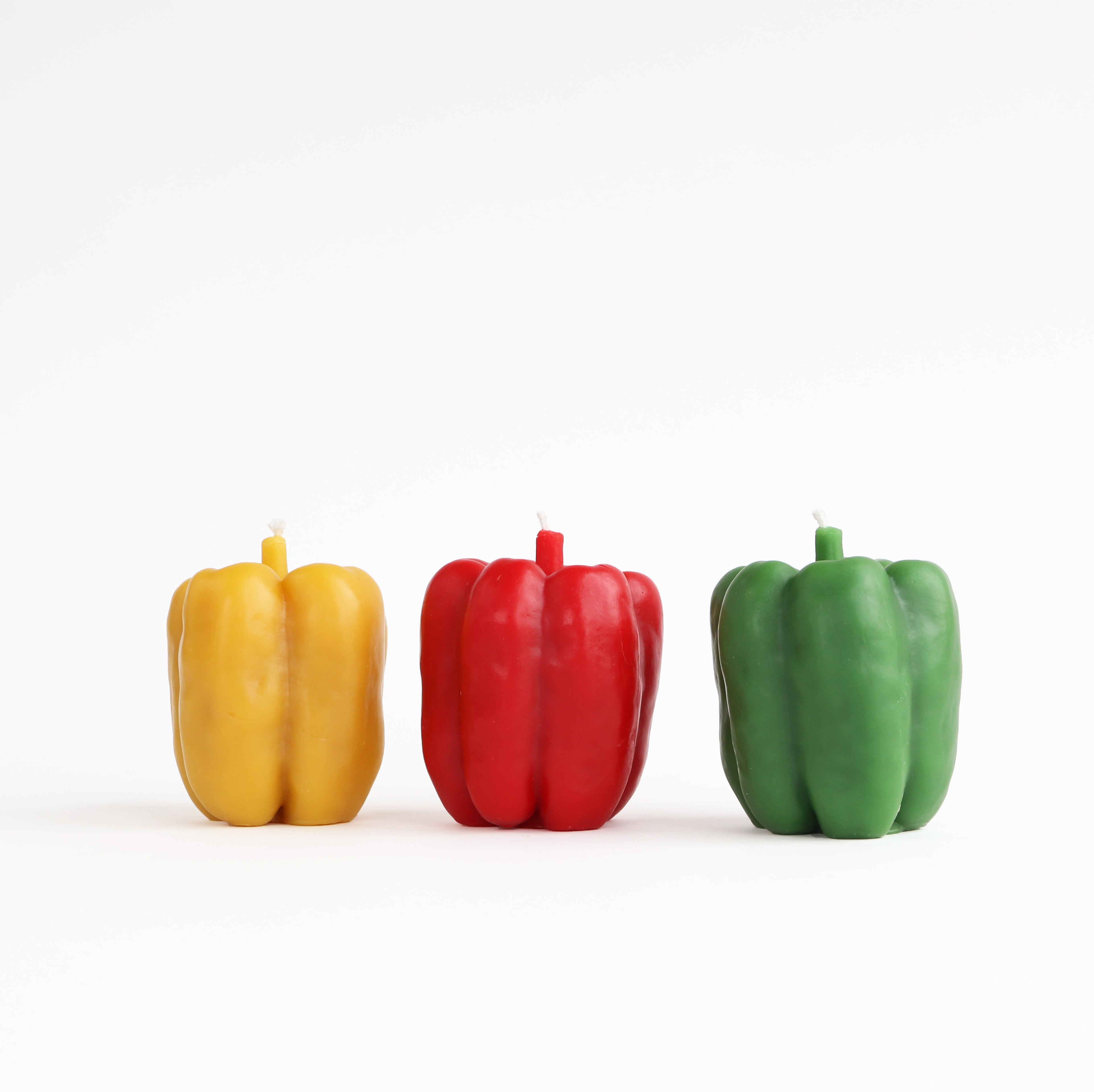 yellow, red and green pepper candle