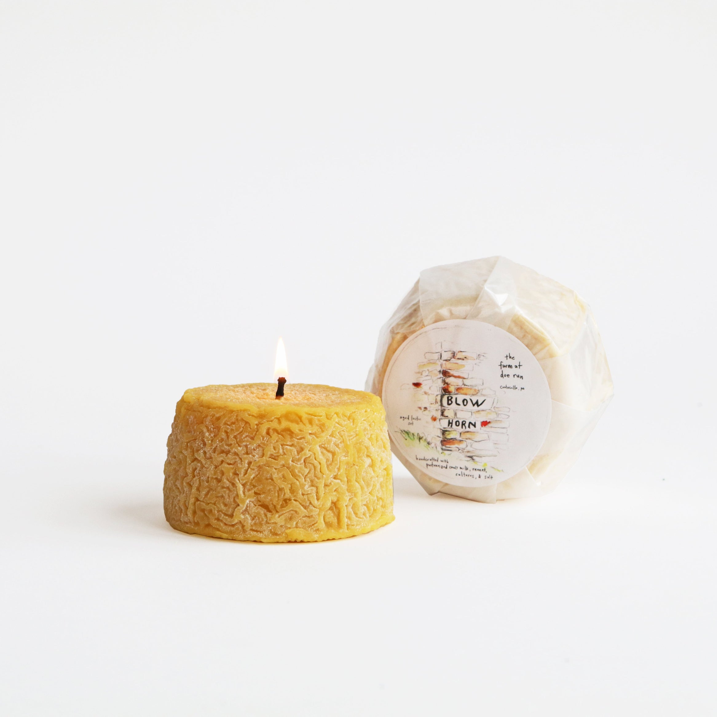 lit cheese candle and cheese