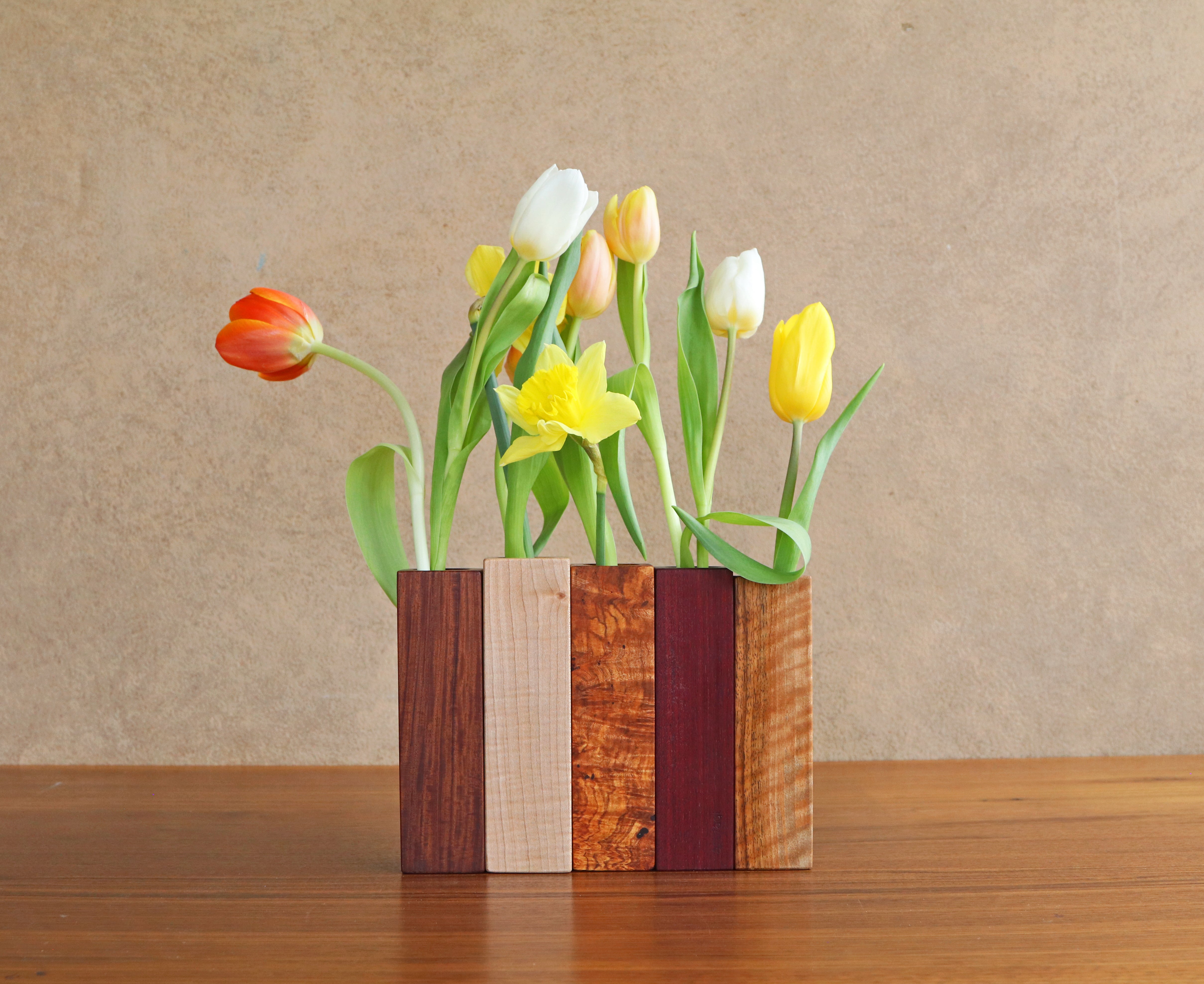 wooden bud vases with spring flowers