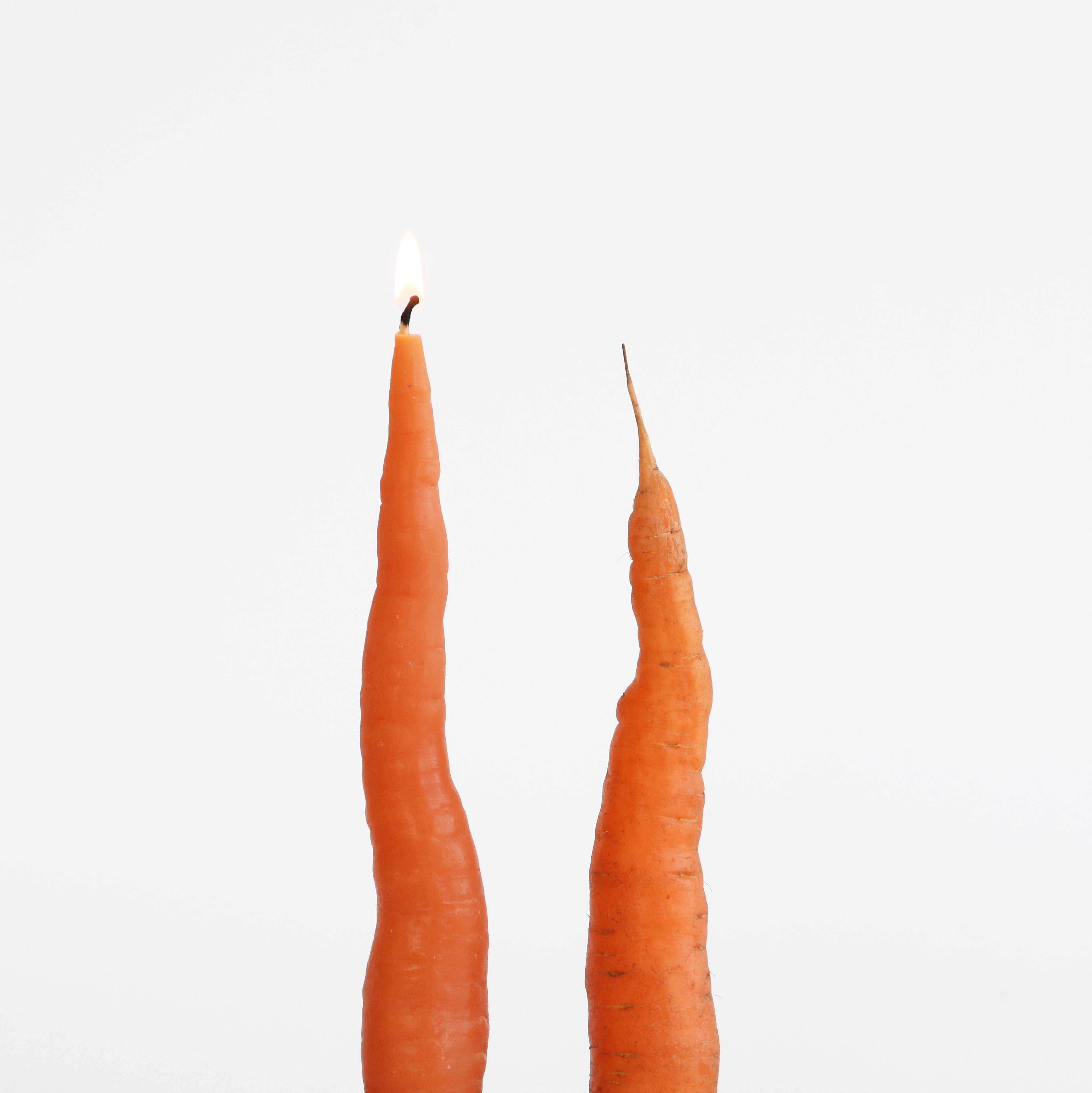 a carrot candle and a carrot