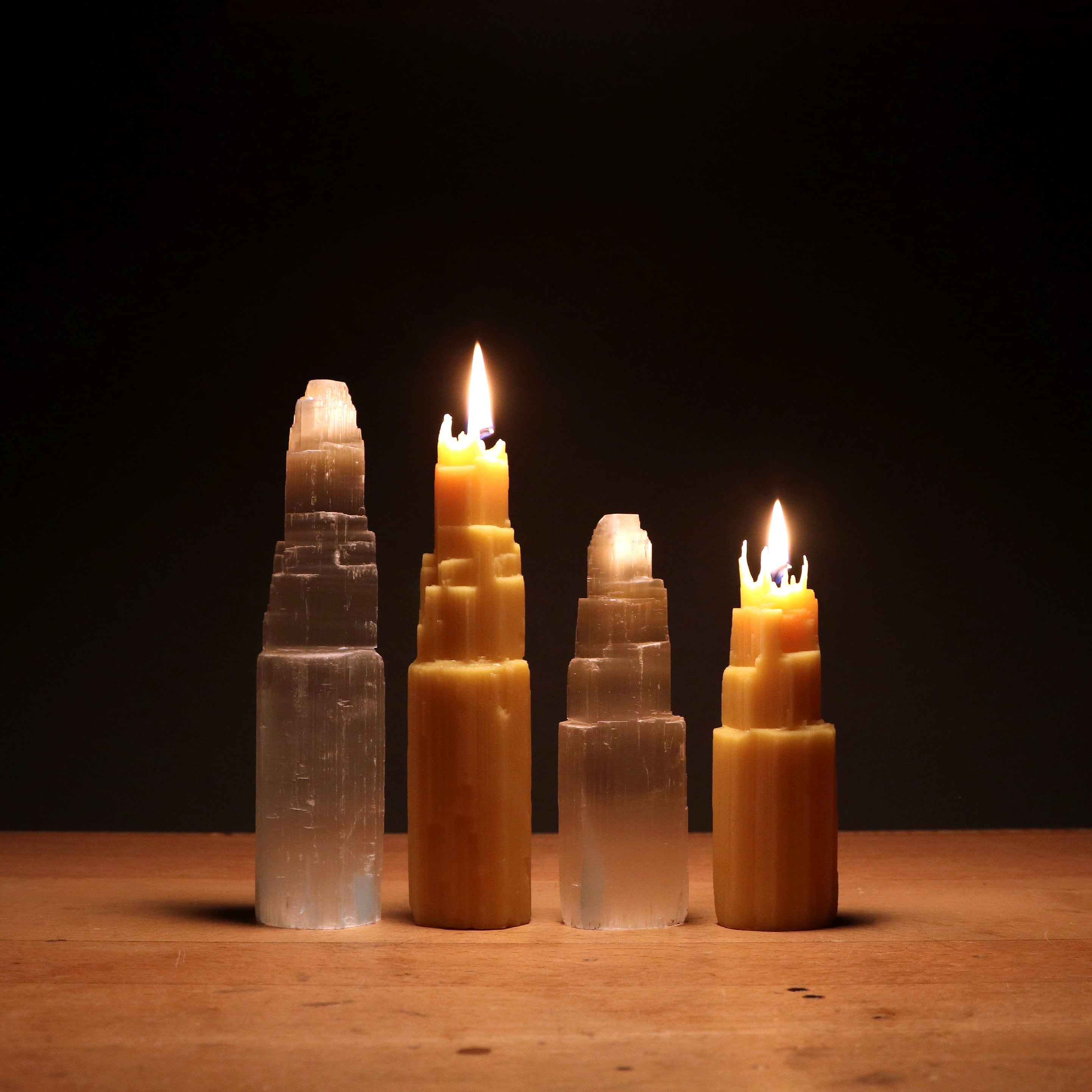 natural beeswax candles lit on table 