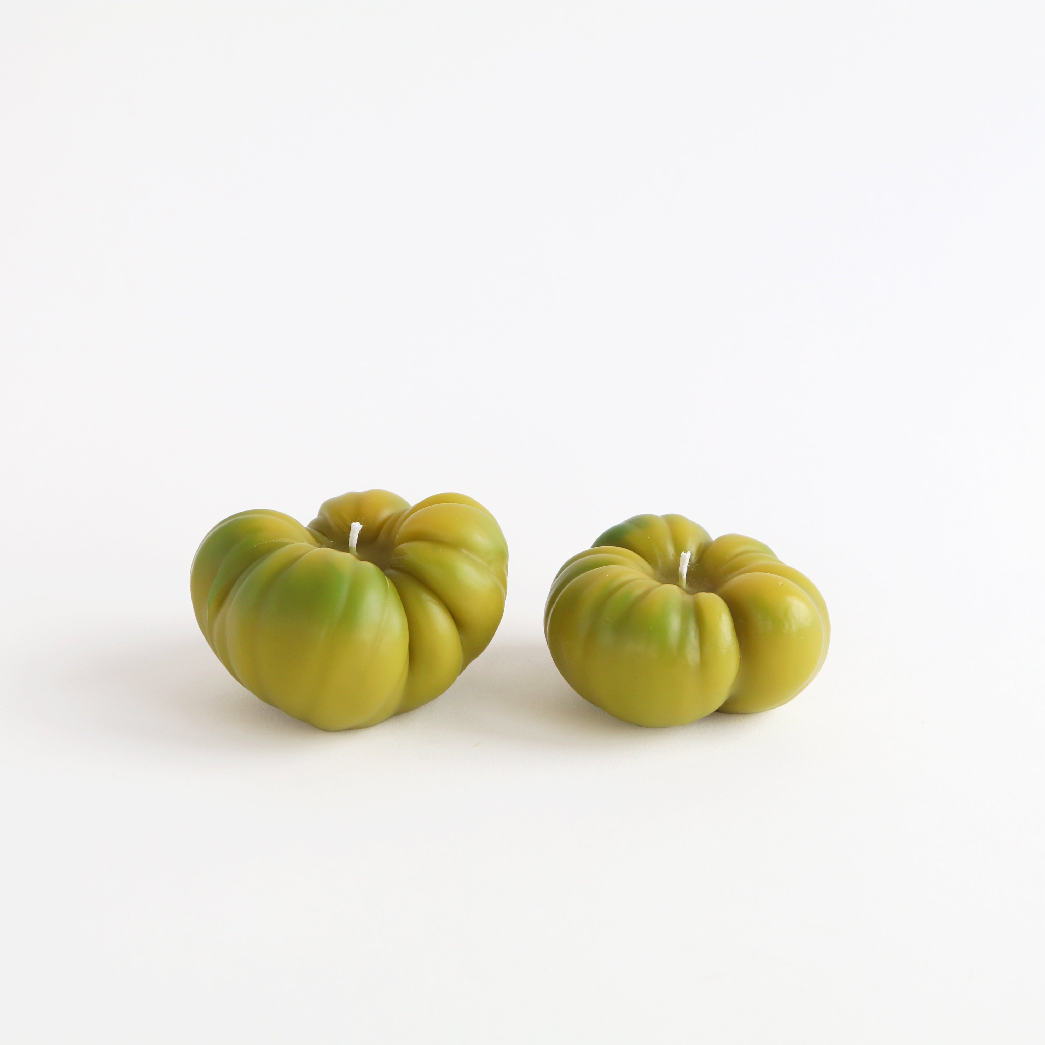 large and small green tomato candles