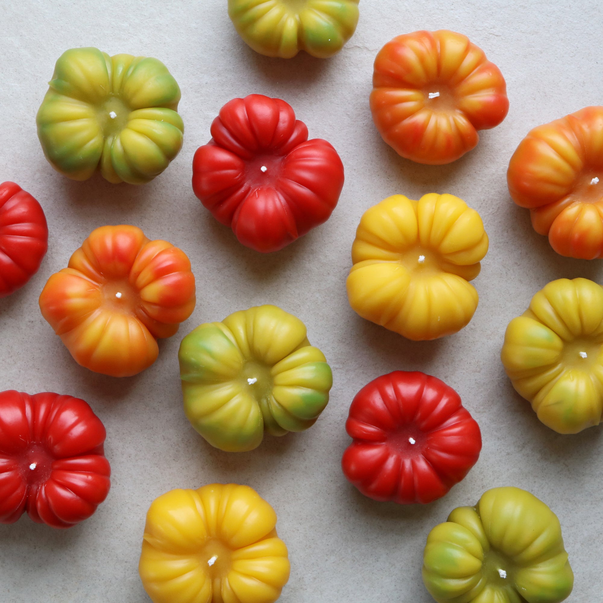 aerial image of tomato candles in various colors 