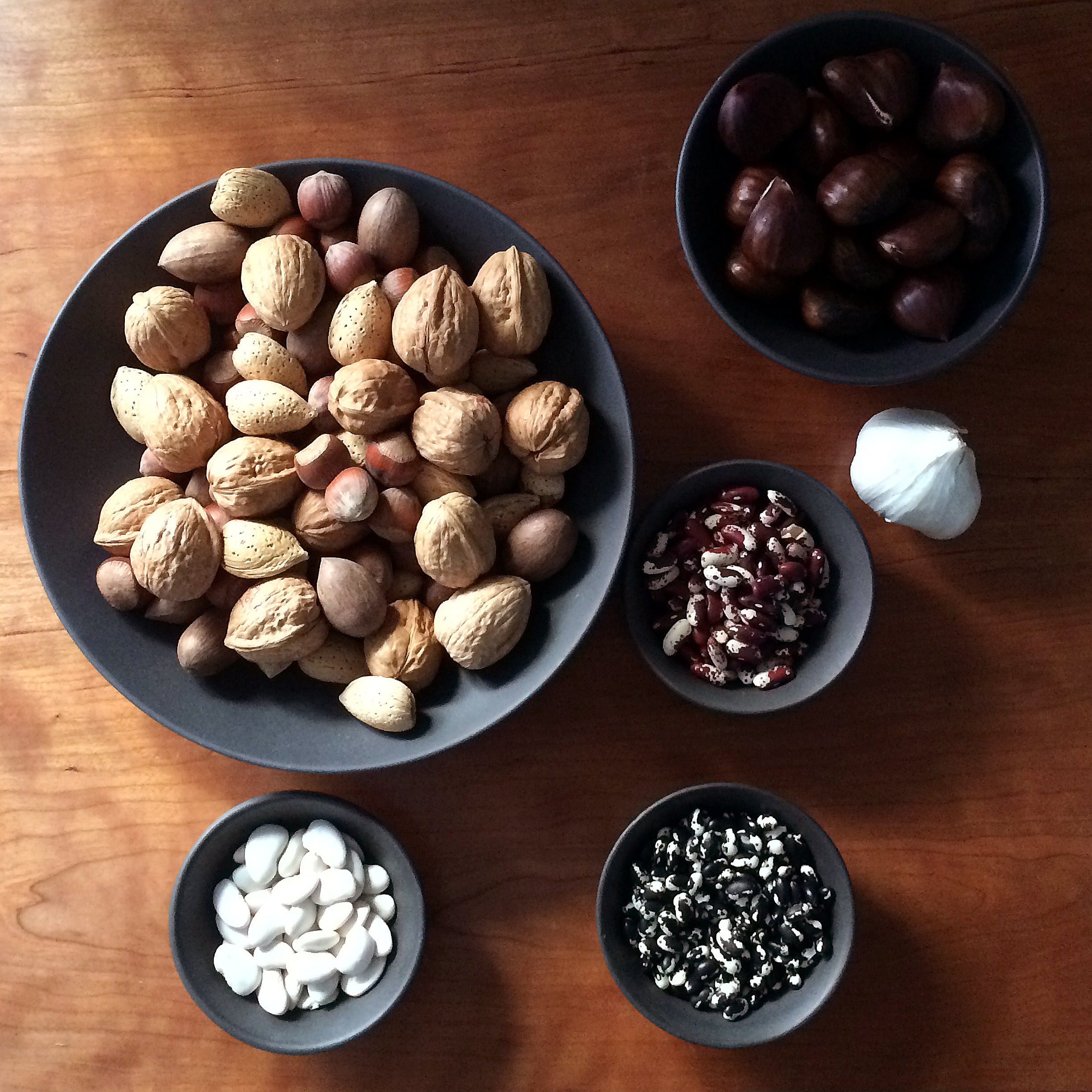 metal bowl set with food and nuts