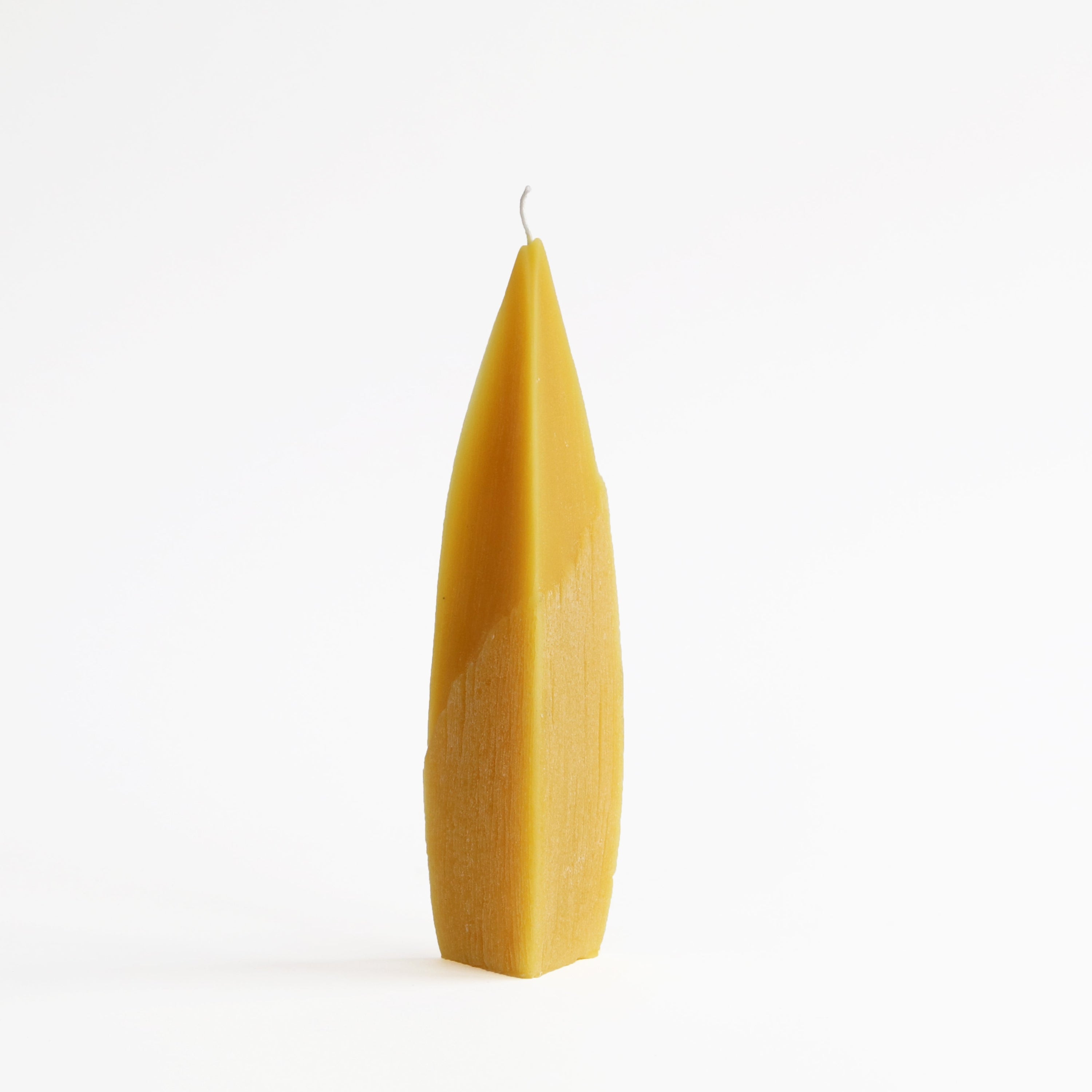 side view of milkweed candle