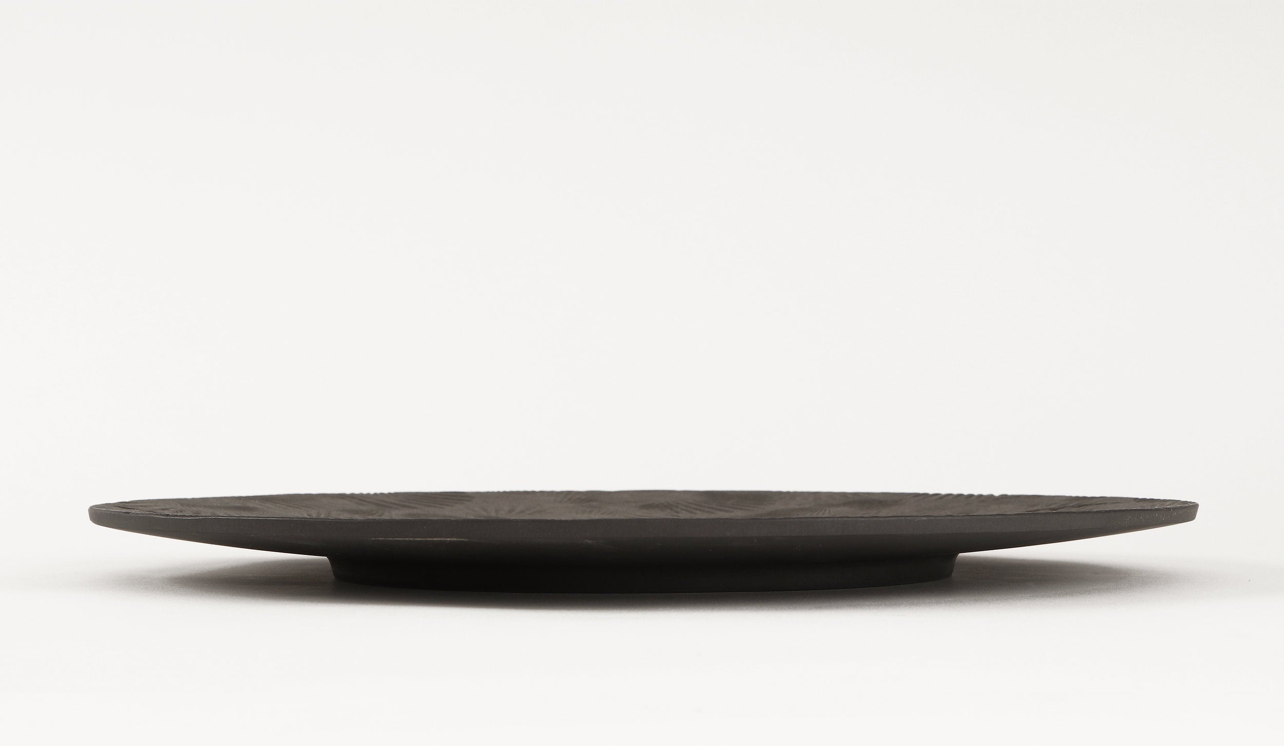 side view of black metal serving tray