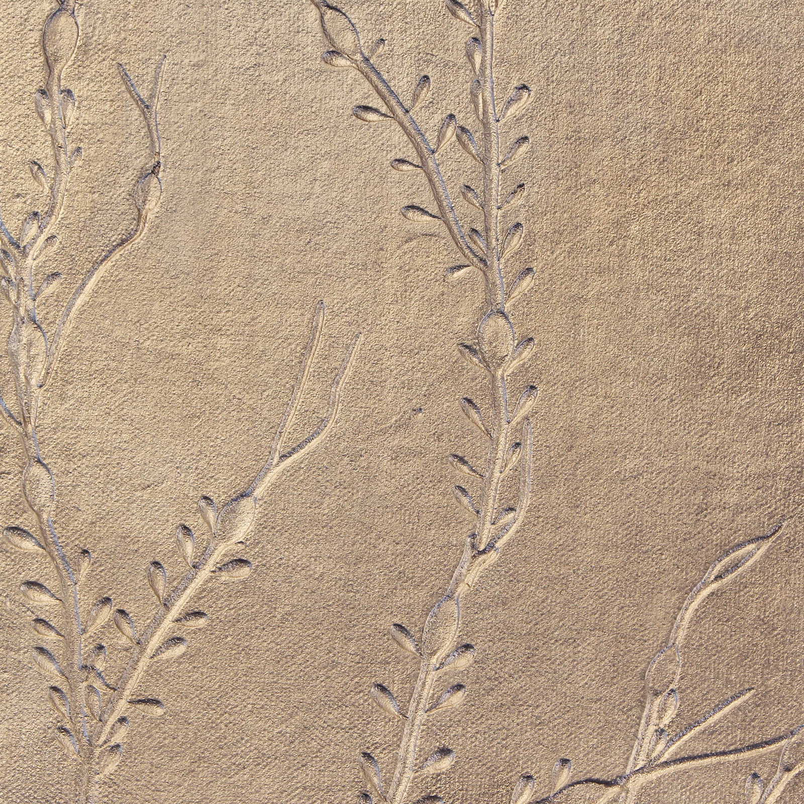 silver metal with seaweed impressions