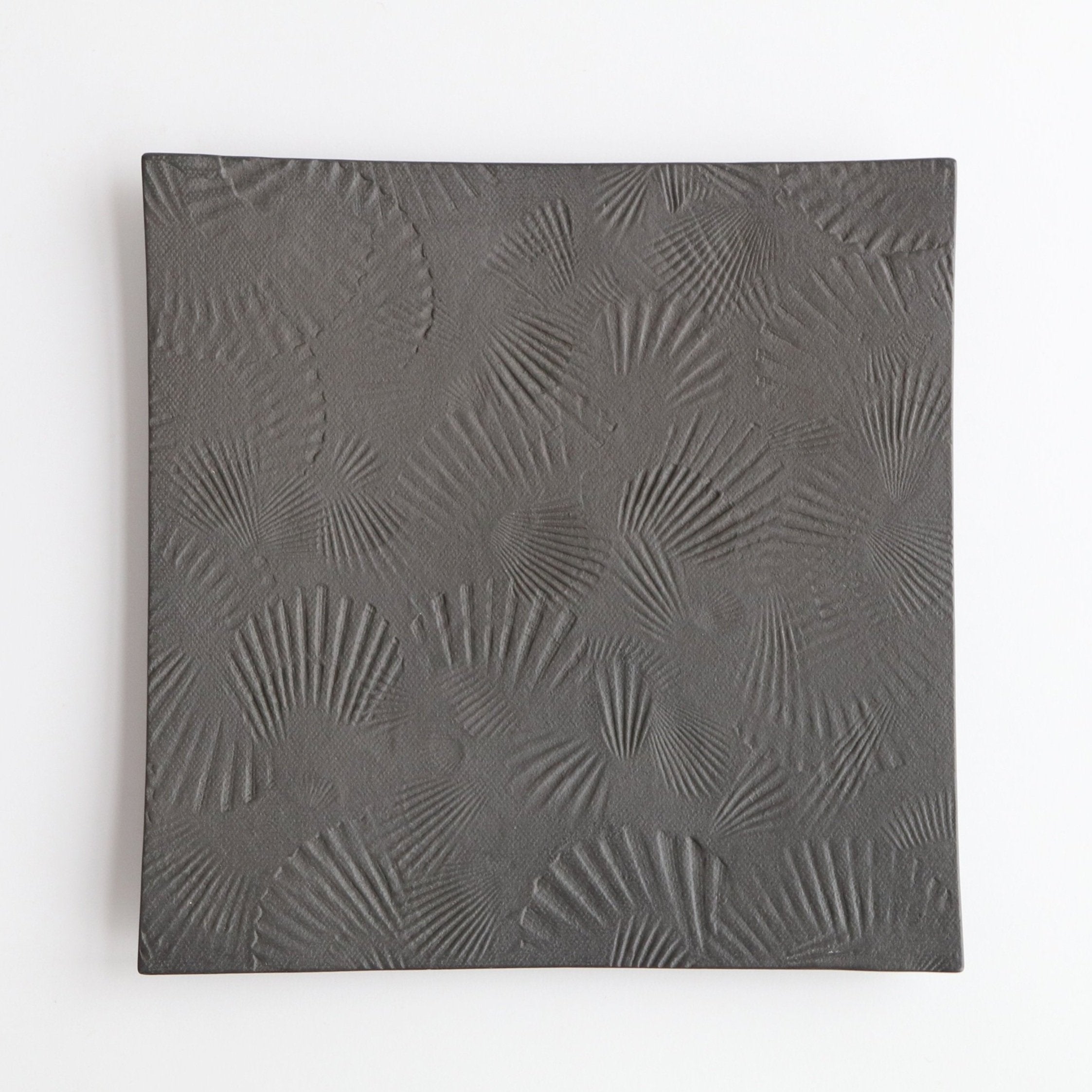 black square metal platter with scallop texture