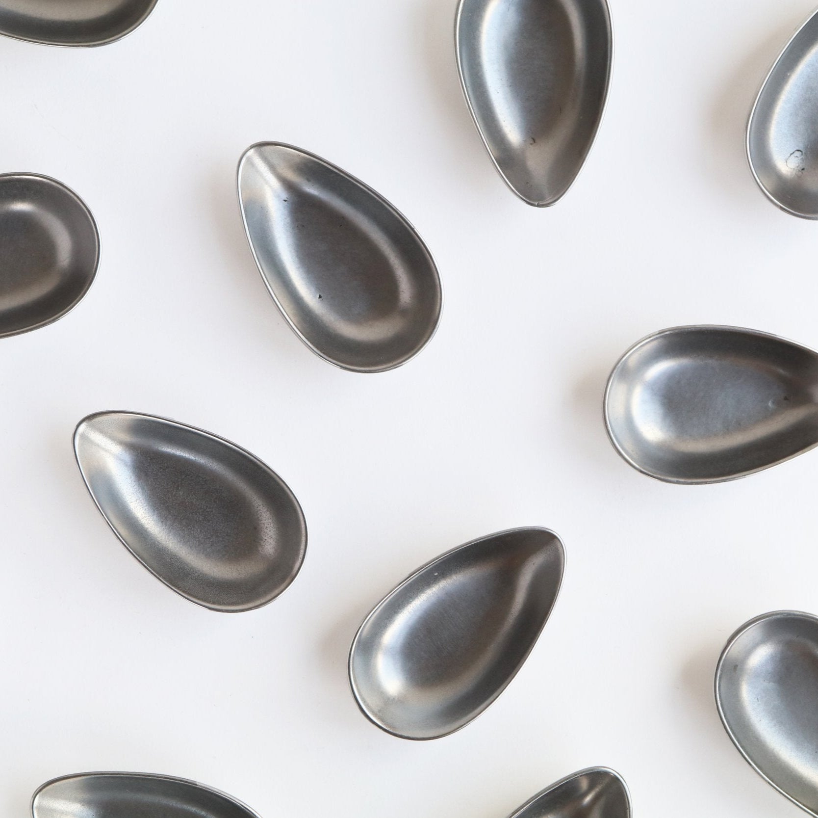 set of small stainless steel metal cups