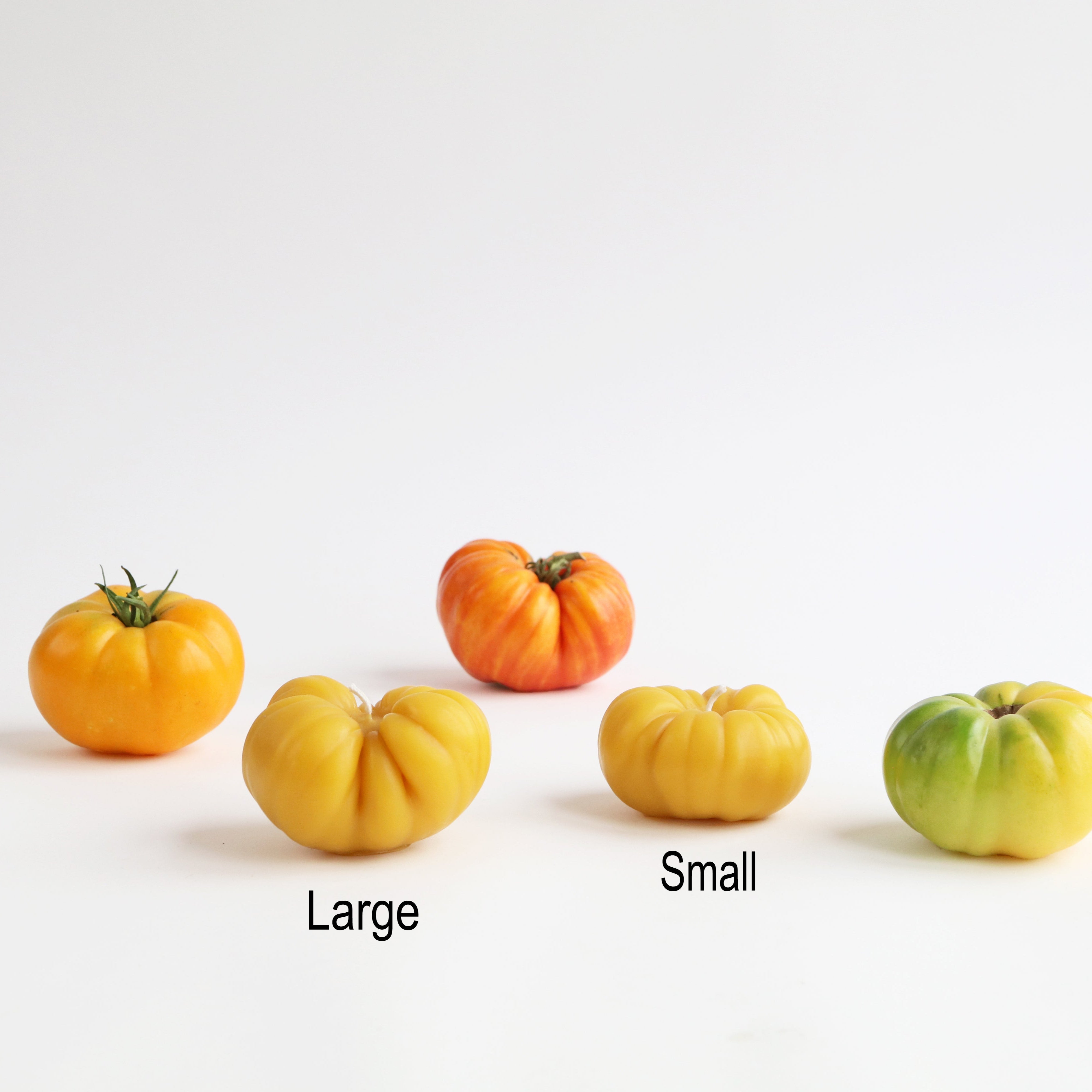picture showing two tomato candle sizes